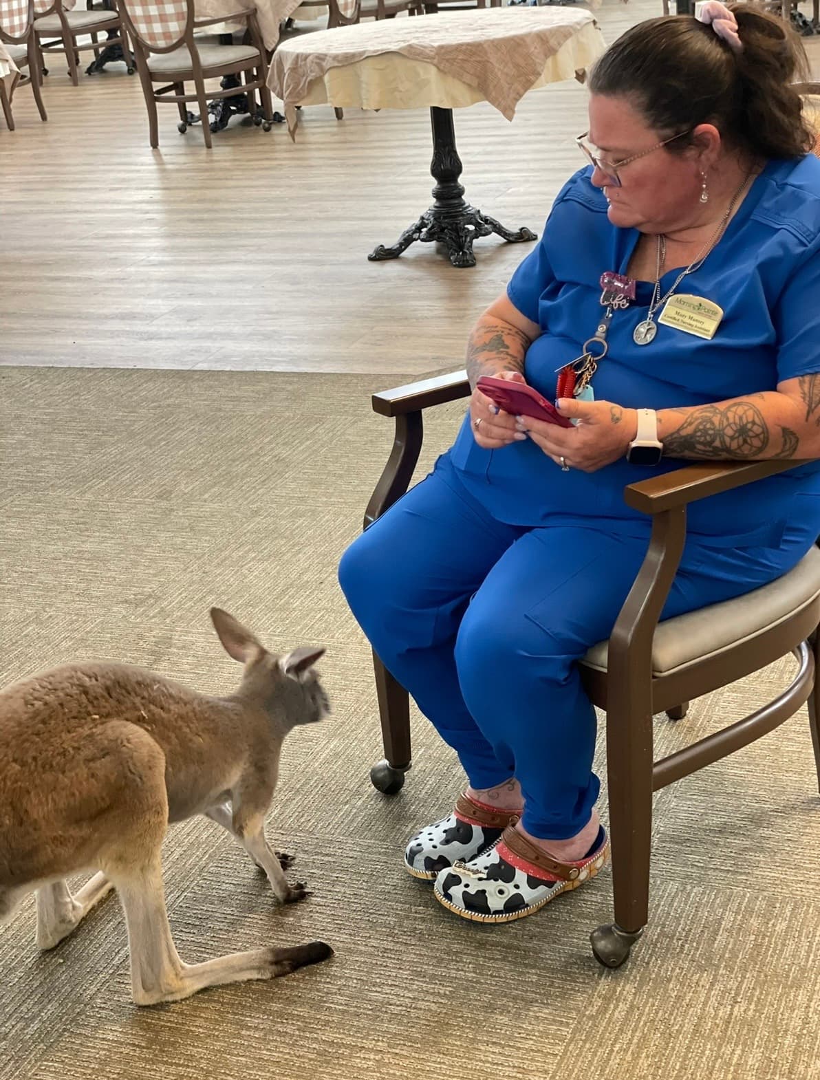 Nursing staff smiling with Sophie the kangaroo